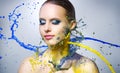 Beautiful girl and colorful paint splashes Royalty Free Stock Photo