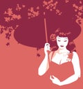 Beautiful girl combed and dressed in retro pinup style holding an umbrella under a flowering tree