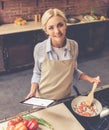 Beautiful girl cooking Royalty Free Stock Photo