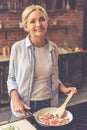 Beautiful girl cooking Royalty Free Stock Photo