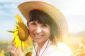 Beautiful Girl in a Cowboy Hat with Sunflowers. Royalty Free Stock Photo