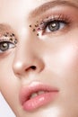 Beautiful girl with creative bright makeup with rhinestones . Beauty face. Royalty Free Stock Photo