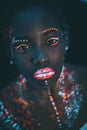 Beautiful girl with creative fluorescent prints on skin Royalty Free Stock Photo