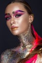 Beautiful girl with creative glitter makeup, sparkles, unusual eyebrows. Beauty is an art face. Royalty Free Stock Photo