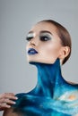 Beautiful girl with creative make-up . Bright colors blue lips. Conceptual art the cosmos, the universe Royalty Free Stock Photo