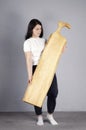 Beautiful girl. Cutting board. Young woman hold a large kitchen board in her hands. Royalty Free Stock Photo