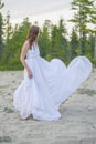 Beautiful girl dancing on the beach.