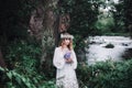 Beautiful girl in a dark forest near the river. Royalty Free Stock Photo