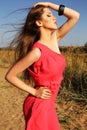 Beautiful girl with dark hair in red dress Royalty Free Stock Photo