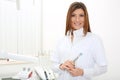 Beautiful girl dentist with mirror and dental probe