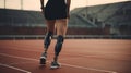 A beautiful girl is disabled with prosthetic legs. Back view of disabled athlete woman with prosthetic legs. Royalty Free Stock Photo