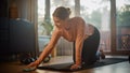 Beautiful Girl Doing Fitness at Home, Setting Mobile Smartphone Timer. Authentic Plus Size Woman Royalty Free Stock Photo