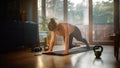 Beautiful Girl Doing Fitness at Home, Using Mobile Smartphone as Timer. Authentic Plus Size Woman Royalty Free Stock Photo