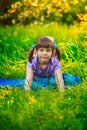 Beautiful girl doing yoga outdoors On green grass Royalty Free Stock Photo