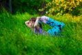 Beautiful girl doing yoga outdoors On green grass Royalty Free Stock Photo