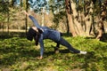 Beautiful girl doing yoga at the park at a sunny day. Royalty Free Stock Photo