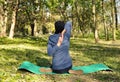 Beautiful girl doing yoga at the park at a sunny day. Royalty Free Stock Photo