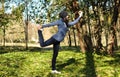 Beautiful girl doing yoga at the park at a sunny day. Royalty Free Stock Photo