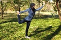 Beautiful girl doing yoga at the park at a sunny day. Royalty Free Stock Photo