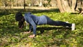 Beautiful girl doing yoga at the park at a sunny day. Royalty Free Stock Photo