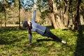 Beautiful girl doing yoga at the park at a sunny day. Royalty Free Stock Photo