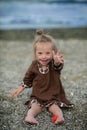 Beautiful girl with Down syndrome on the beach Royalty Free Stock Photo