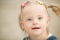 Beautiful girl with Down syndrome on the beach Royalty Free Stock Photo