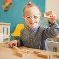Beautiful girl with down syndrome engaged in class Royalty Free Stock Photo