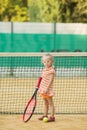 Beautiful girl with Down syndrome playing tennis