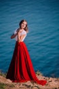 Beautiful girl dressed in white and red dress