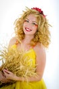 Beautiful girl dressed yellow with wheaten ears