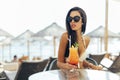 Beautiful girl drinking cocktail on beach Royalty Free Stock Photo