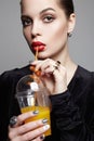 Beautiful girl drinking fresh orange juice. Healthy young woman Royalty Free Stock Photo