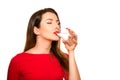 Beautiful Girl Drinking a Glass of Pure Water Smiling.Closing Eyes Royalty Free Stock Photo