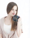 Beautiful Girl Drinking Tea or Coffee. Beauty Woman with Cup of Hot Beverage. Enjoying Coffee. Warm Pastel Colors Royalty Free Stock Photo