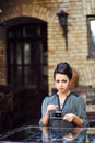 Beautiful girl drinking tea or coffee in cafe Royalty Free Stock Photo