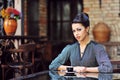 Beautiful girl drinking tea or coffee in cafe Royalty Free Stock Photo