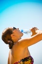 Beautiful girl drinking water