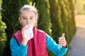 Beautiful girl is drinking water the hot sun in the park Royalty Free Stock Photo