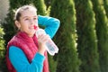 Beautiful girl drinking water after jogging in outdoor Royalty Free Stock Photo