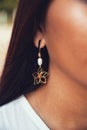 Girl with her detalles spring earrings flower
