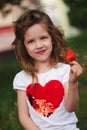 Beautiful girl eating big juicy strawberry Royalty Free Stock Photo