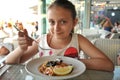 Beautiful girl eating sea fruit pasta at an italian restaurant Royalty Free Stock Photo