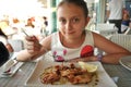 Beautiful girl eating seafood  at an italian restaurant Royalty Free Stock Photo