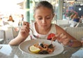 Beautiful girl eating seafood  at an italian restaurant Royalty Free Stock Photo