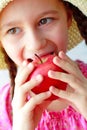 Beautiful girl eats orange