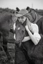Beautiful girl embraces a foal Royalty Free Stock Photo