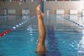 Beautiful girl is engaged in synchronized swimming