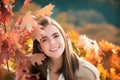 Beautiful girl enjoying autumn. Portrait of beautiful young woman walking outdoors in autumn. Young woman and autumn Royalty Free Stock Photo