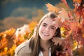 Beautiful girl enjoying autumn. Portrait of beautiful young woman walking outdoors in autumn. Young woman and autumn Royalty Free Stock Photo